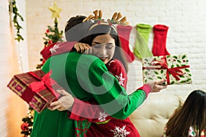 Lovers Celebrating With Christmas Presents At Home