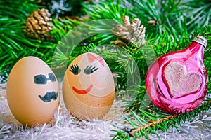 Lovers on Christmas, cartoon . Unusual eggs with faces, muzzle.