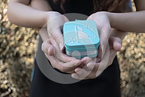 Lovers couple holding blue gift box for wedding and love conce