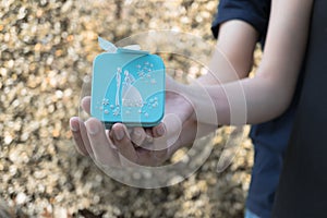 Lovers couple holding blue gift box for wedding and love conce