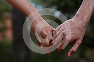 Lovers couple holding hands