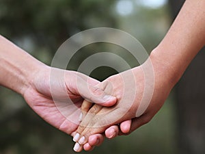 Lovers couple holding hands