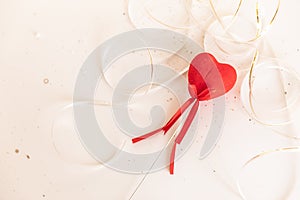 Lovers` day. Valentine`s Day. a single red heart on a white isolated background