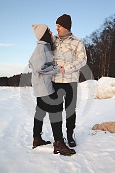 Lovers embrace in the winter on the street