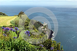 Lovers in a garden house near the old lighthouse in Nordeste photo