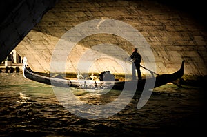 Lovers in Gondola under a Bridge in Venice