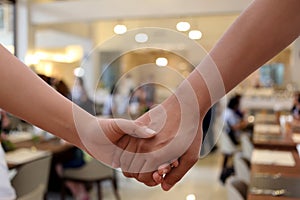 Lovers hand in hand, Couples holding hands in Restaurant background