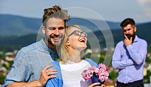 Lovers hugs outdoor flirt romance relations. Couple romantic date lovers bouquet flowers. Infidelity concept. Couple in