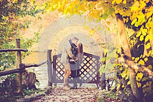 Lovers kissing in fall