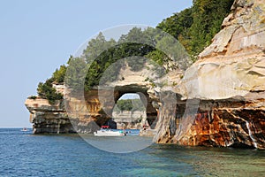 Lovers Leap Arch in Pictured Rocks National Lakeshore, Munising, Michigan, USA from a boat in a sunny afternoon of