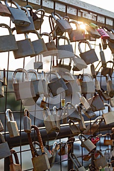 Locks of lovers on a chain link fence.
