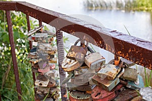 Lovers' locks hang on the bridge closeup