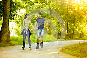 Lovers in nature on rollerblades photo