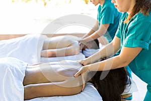 Lovers Receiving Back Massage At Dayspa