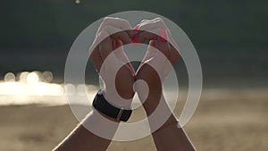 Lovers show a heart sign with their own hands