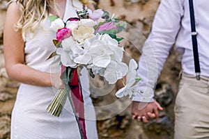 Lovers sitting holding hands