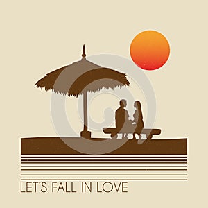 Lovers sitting under straw umbrella