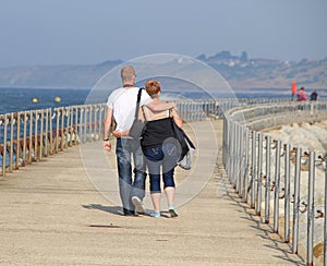 Lovers Walking Arm In Arm