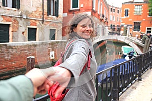 Lovers walking on Venice streets. Happy romantic vacation in Italy. Couple enjoying in Venice