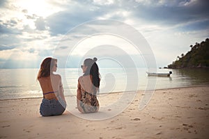 Lovers young couple of girls. On the beach . Concept of LGBT