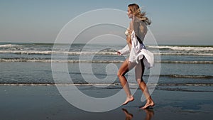 She loves the feeling of sand and wind near the ocean