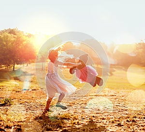 She loves playing with her teddy in nature. an adorable little girl playing with her teddybear outdoors.