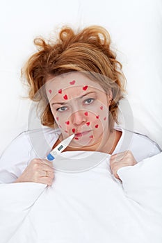 Lovesick woman laying in bed