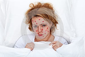 Lovesick woman laying in bed