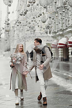 lovestory couple Love coat beige gray white bouquet of flowers tenderness feelings walk Hug date