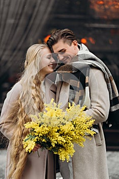 lovestory couple Love coat beige gray white bouquet of flowers tenderness feelings walk Hug date