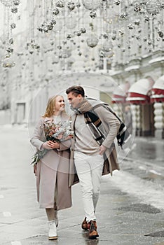 lovestory couple Love coat beige gray white bouquet of flowers tenderness feelings walk Hug date