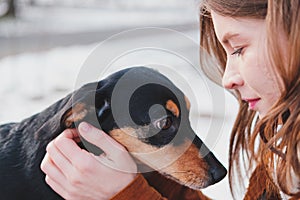 Loving and adoring dogs: woman with her puppy. photo