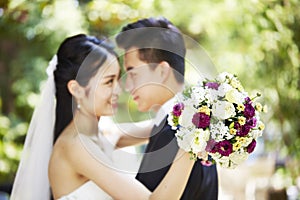 Loving asian newly-wed photo
