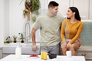 Loving beautiful young couple bonding while have breakfast at home