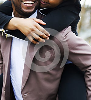 Loving black couple is hugging and smiling