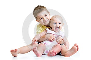 Loving brother and little sister hugging isolated