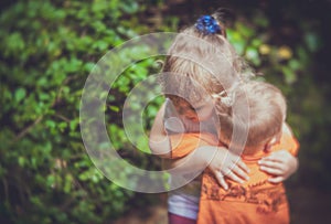 Big brother and sister hug photo