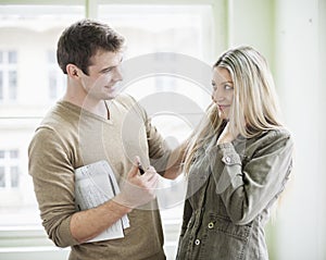 Loving business couple looking at each other in office