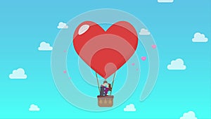 Loving coule are kissing on big heart balloon motion
