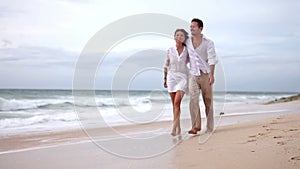 Loving couple on beach in slow motion