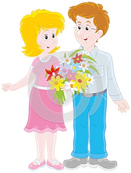 Loving couple with a bouquet of flowers photo