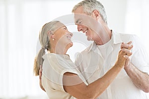 Loving Couple Dancing At Home