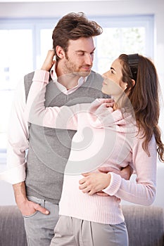 Loving couple embracing kissing