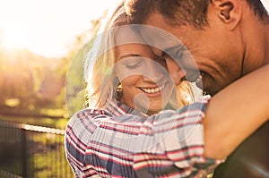 Loving couple embracing at park