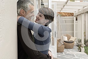 Loving Couple Embracing At Porch