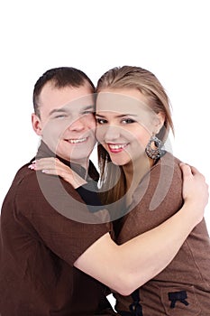 Loving couple embracing on white background