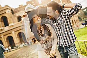 Loving couple in front of the Colosseum in Rome