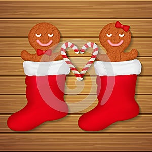 Loving couple of gingerbread cookies in red socks