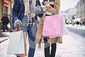 Loving couple going shopping together in winter