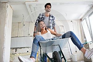 Loving couple is having fun while they are renovating house